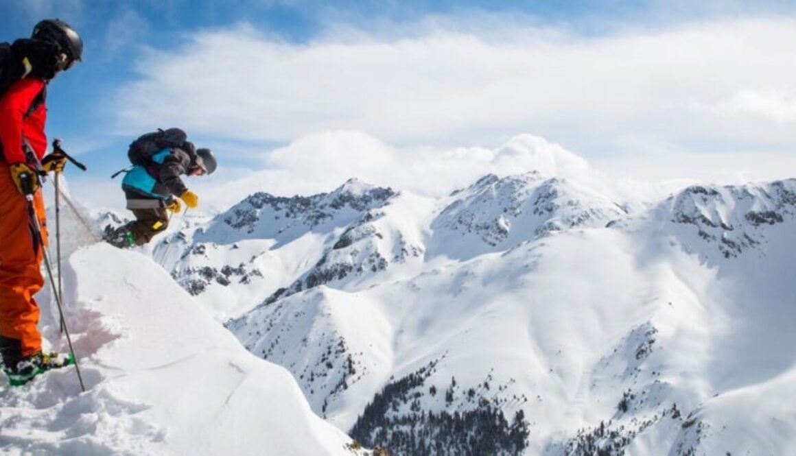 best activities at snoqualmie pass - snow skiers on mountain top