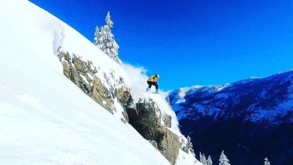 snowboarder sending it over a cliff, skiing, send it